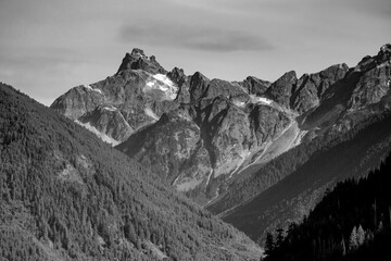 Black and white photo of the peaks of Mountains from Chilliwack lake provincial park in British Columbia, Canada
