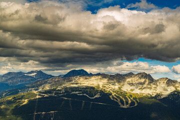 Breathtaking view of the mountains peaks and clouds in Whistler British Columbia, Canada