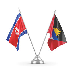 Antigua and Barbuda and North Korea table flags isolated on white 3D rendering