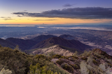 Sunset over Eagle Peak and Bald Ridge via the Main Peak, with the city of Clayton in the...