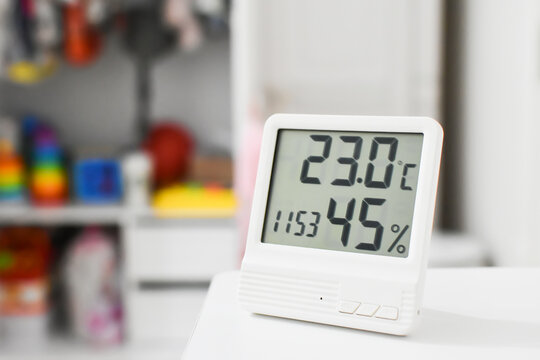 Digital clock, thermometer and  hygrometer for nursery or children room. 