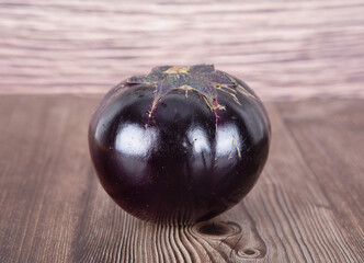 A purple eggplant on the table