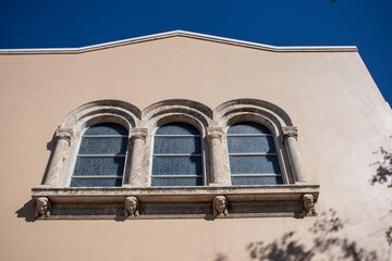 window of a church with walls champagne sailboat color