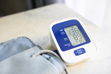 Blood Pressure Monitor Digital on table , Medical electronic tonometer check blood pressure and heart rate Health and Medical concept.