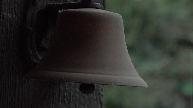Old bell in rain