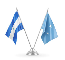 Micronesia and Nicaragua table flags isolated on white 3D rendering