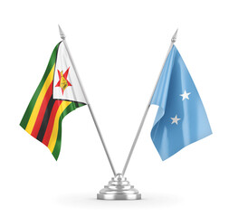 Micronesia and Zimbabwe table flags isolated on white 3D rendering