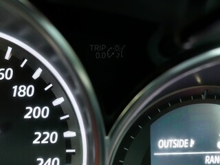 closeup miles of car or speedometer.