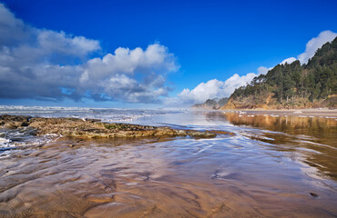 Beach from Arch Cape to Hug Point and Cannon Beach at low tide on a Winter afternoon
