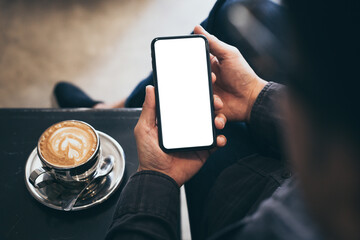 cell phone blank white screen mockup.man hand holding texting using mobile on desk at office.background empty space for advertise.work people contact marketing business,technology