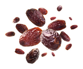 Dried dates levitate on a white background