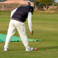 New Delhi India – July 01 2018 : Full length of cricketer playing on field during sunny day in...