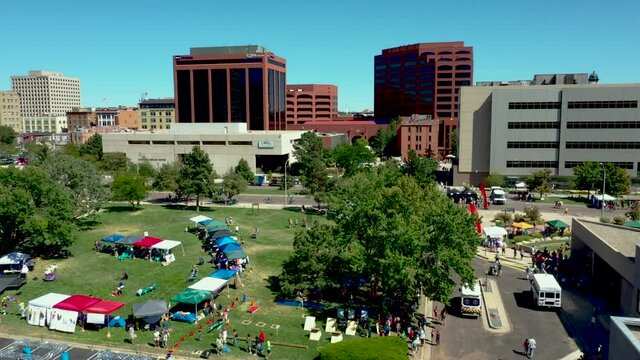 Aerial view of park in downtown Colorado Springs, CO during festival view of skyline