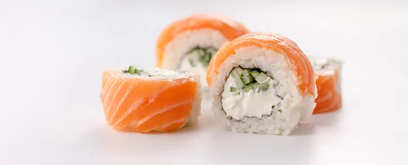 Gordijnen Philadelphia roll sushi on a white plate. Isolated. Restaurant concept. Close-up. © Danil