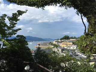 View of stormy Miyajima Island Japan through circle of trees