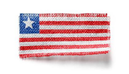 Liberia flag on a piece of cloth on a white background