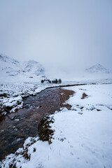 the majestic buachaille etive mor on rannoch moor and glencoe in the argyll region of the highlands of scotland during a snow storm in winter