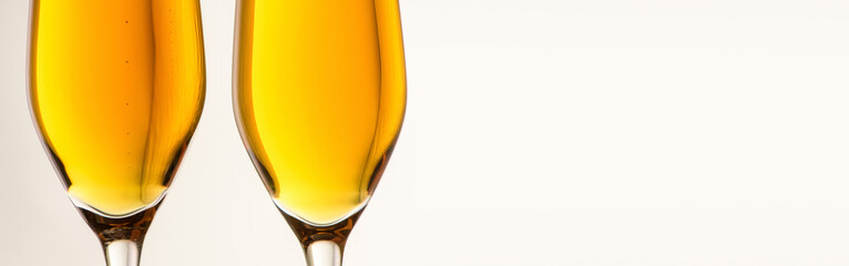 .Two glasses of champagne, wine on a gray background. Alcoholic drink: champagne, beer, white wine....