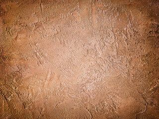 Texture of old wall with decorative plaster brown and brick colors.