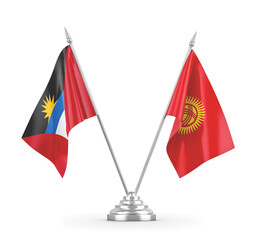 Kyrgyzstan and Antigua and Barbuda table flags isolated on white 3D rendering 