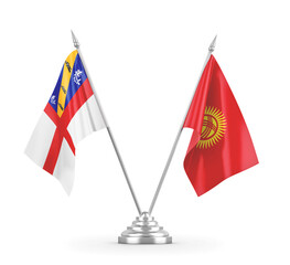 Kyrgyzstan and Herm table flags isolated on white 3D rendering