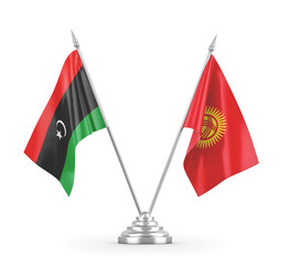 Kyrgyzstan and Libya table flags isolated on white 3D rendering