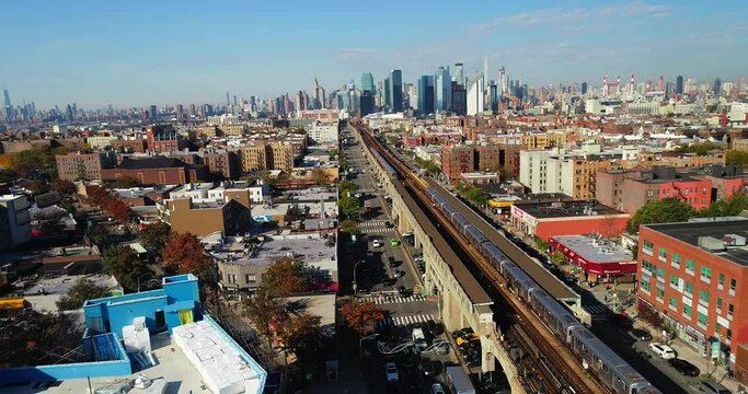 Slider Drone Shot of Subway Station and LI City in the Background