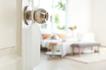 View of stylish room through open door, closeup