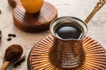 Cezve with coffee on table