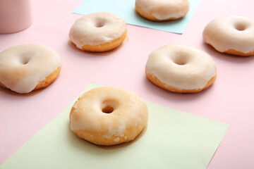 Tasty donuts on color background