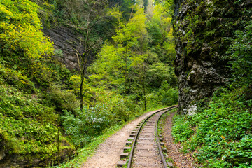 Old narrow gauge railway in mountain region.