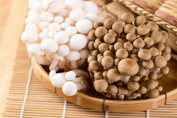 Fresh brown and white Shimeji mushroom in a bamboo basket, Asian mushroom