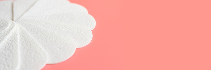 pure empty women's disposable daily menstrual sanitary pads or napkins pattern on pink background. banner