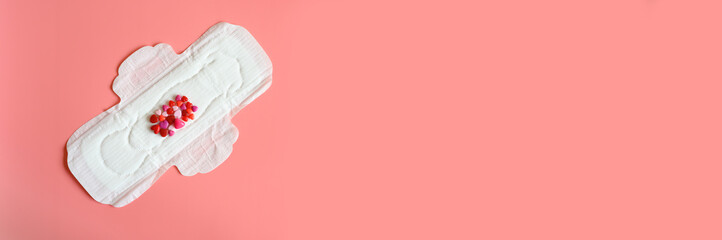 women's menstrual sanitary pad or napkin for normal profusion of secretions with red and pink beads...