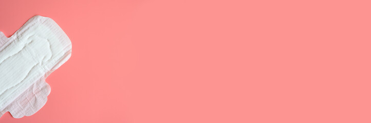 pure empty women's disposable menstrual sanitary pad or napkin for normal abundance of secretions on pink background. banner