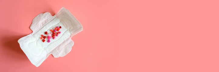 women's menstrual sanitary pad or napkin for normal profusion of secretions with red and pink beads...