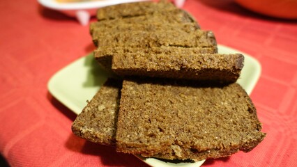 Sliced vort bread served on a green saucer