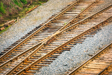Fototapeta premium A high angle view of railroad tracks splitting off into 2 different directions.