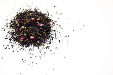 Black tea with rose petals. On a white background.