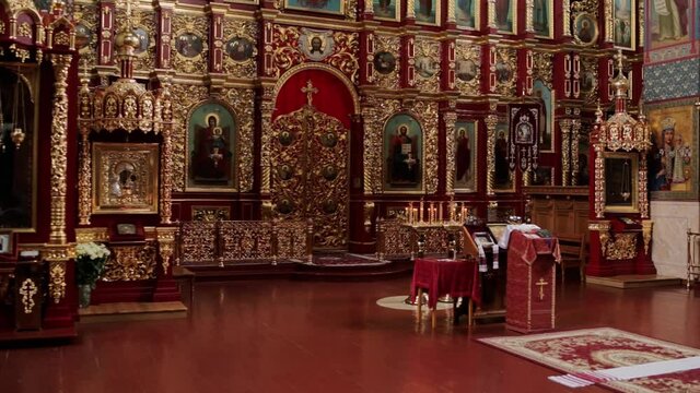 beautiful golden church room with icons and candles