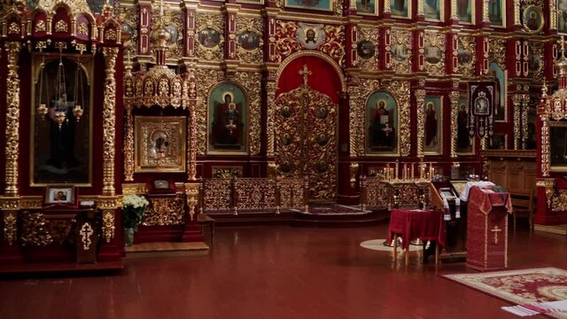 beautiful golden church room with icons and candles