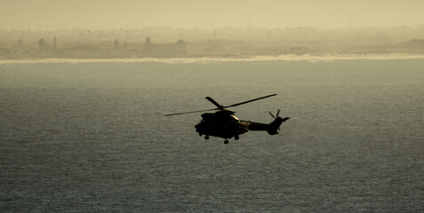 Fototapeta na wymiar Helicopter at sea for Navy training exercises
