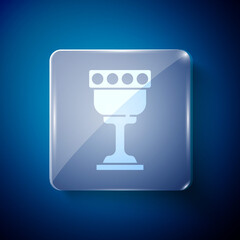 White Medieval goblet icon isolated on blue background. Holy grail. Square glass panels. Vector.