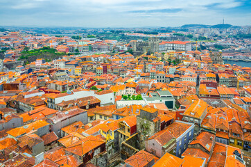 Aerial panoramic view of Porto Oporto city historical centre with red tiled roof typical buildings,...