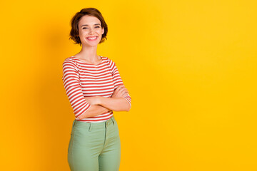 Obraz premium Photo of gorgeous successful young person crossed hands isolated on bright yellow color background