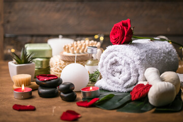 Fototapeta na wymiar Wellness decoration, spa massage setting, oil on wooden background. Valentine's Day Zen and relax concept.