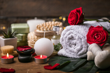 Obraz na płótnie Canvas Wellness decoration, spa massage setting, oil on wooden background. Valentine's Day Zen and relax concept.