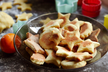 Cooking cookies for the new year and christmas. Flour and dough, cookie cutters.