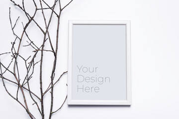Mockup blank wooden photo frame with grass branches