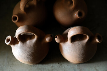 Handcrafted water vessels, pottery made with raw earthen clay at a souvenir shop, handmade vintage...